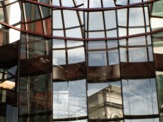 HSBC Vatican Bank Accounts Probe Resurfaces HSBC bank building exterior with Vatican City skyline in background