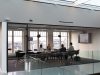 BBC Cuts 2,000 Jobs as Frozen License Fee Bites Empty BBC newsroom desks lit by overhead lights after 2,000 job cuts announcement