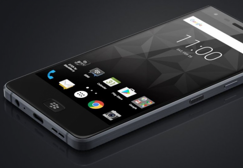 TCL and BlackBerry logos on a smartphone display at a technology trade show