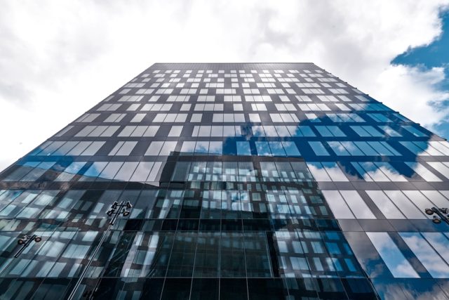 HSBC pays €294 million to settle Belgian criminal case from 2014 data leak HSBC bank building exterior with a sign showing the company logo in Geneva, Switzerland.