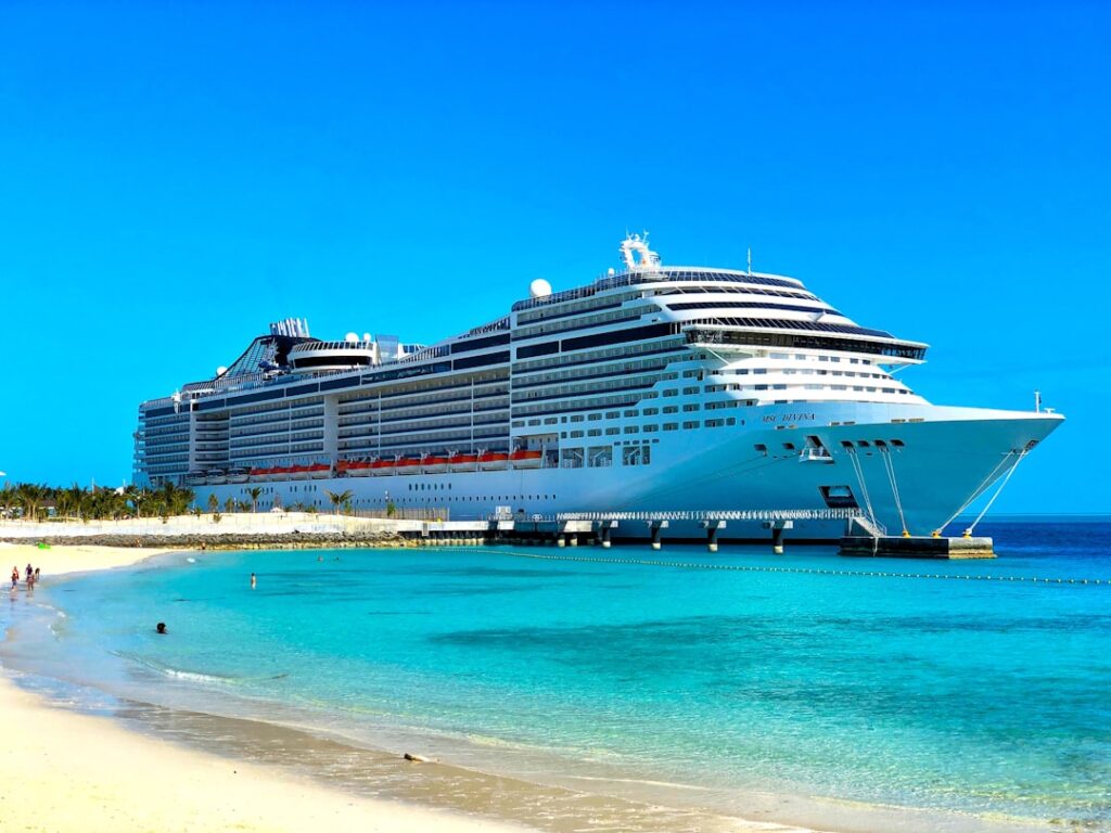 A cruise ship sits anchored off the West African coast under quarantine, with medical personnel in protective gear boarding to screen passengers.