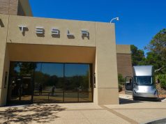 Tesla Kicks Off Semi Volume Production April 2026 Tesla Semi electric truck parked outside Giga Nevada factory, ready for freight transport