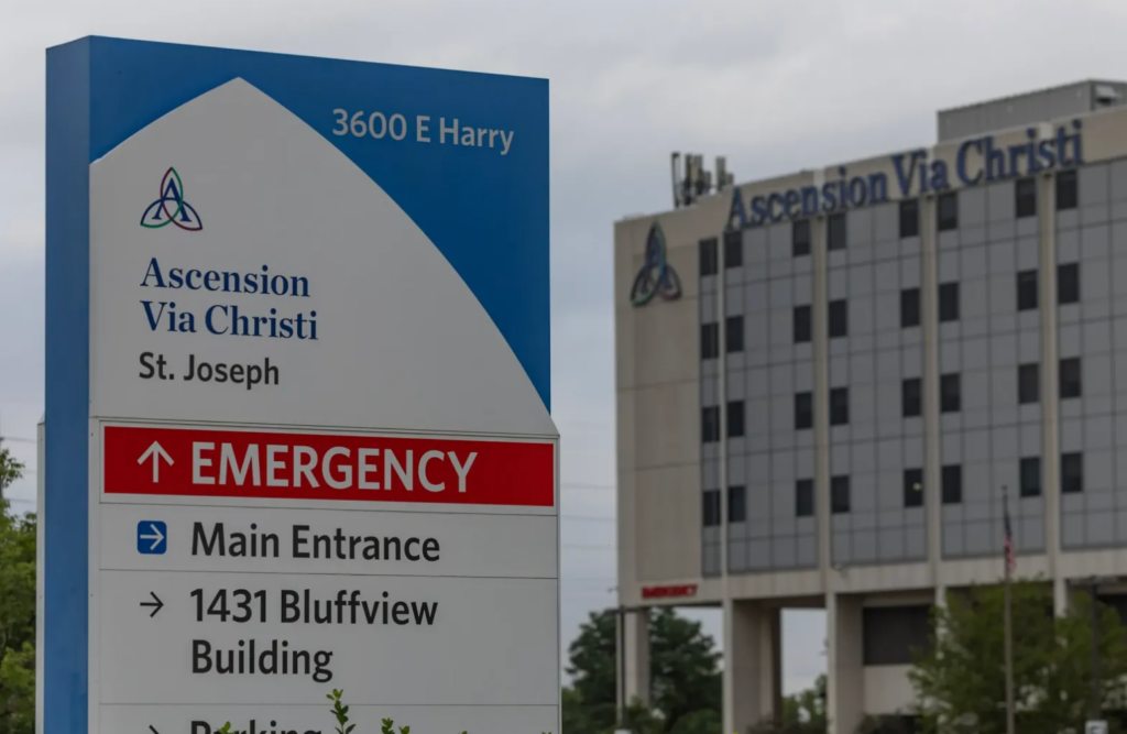 Ascension hospital building exterior with patients and medical staff entering the facility