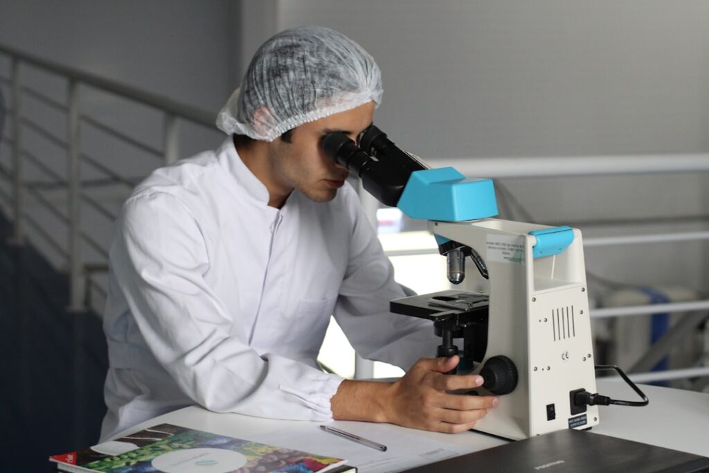 A Cologuard test kit box sits on a table, representing the at-home colorectal cancer screening product central to Abbott's acquisition of Exact Sciences.