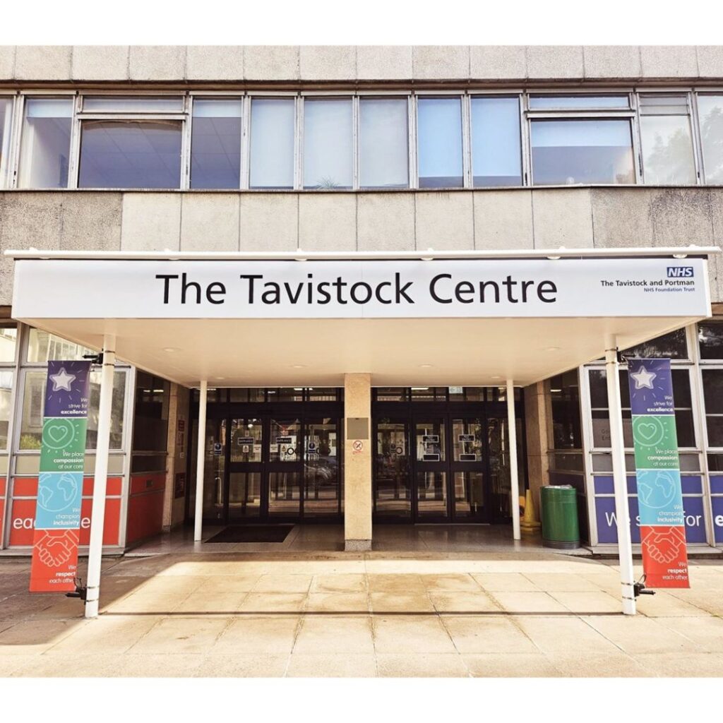 Exterior of the Tavistock Centre with NHS signage, symbolizing the shuttered youth gender service.