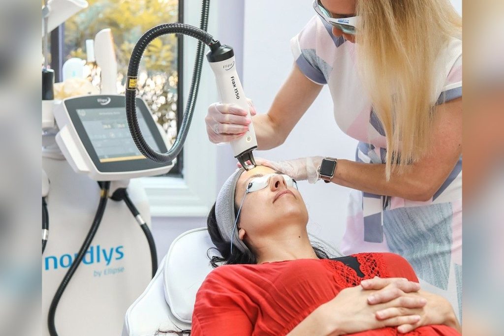 Researcher Using Nordlys Laser On A Patient S Skin